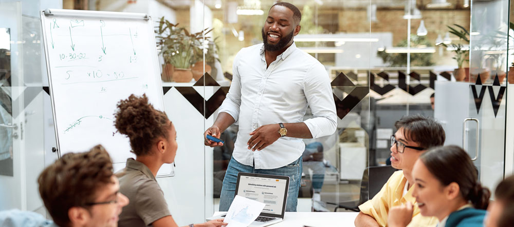 Man leading a business meeting about building an online store